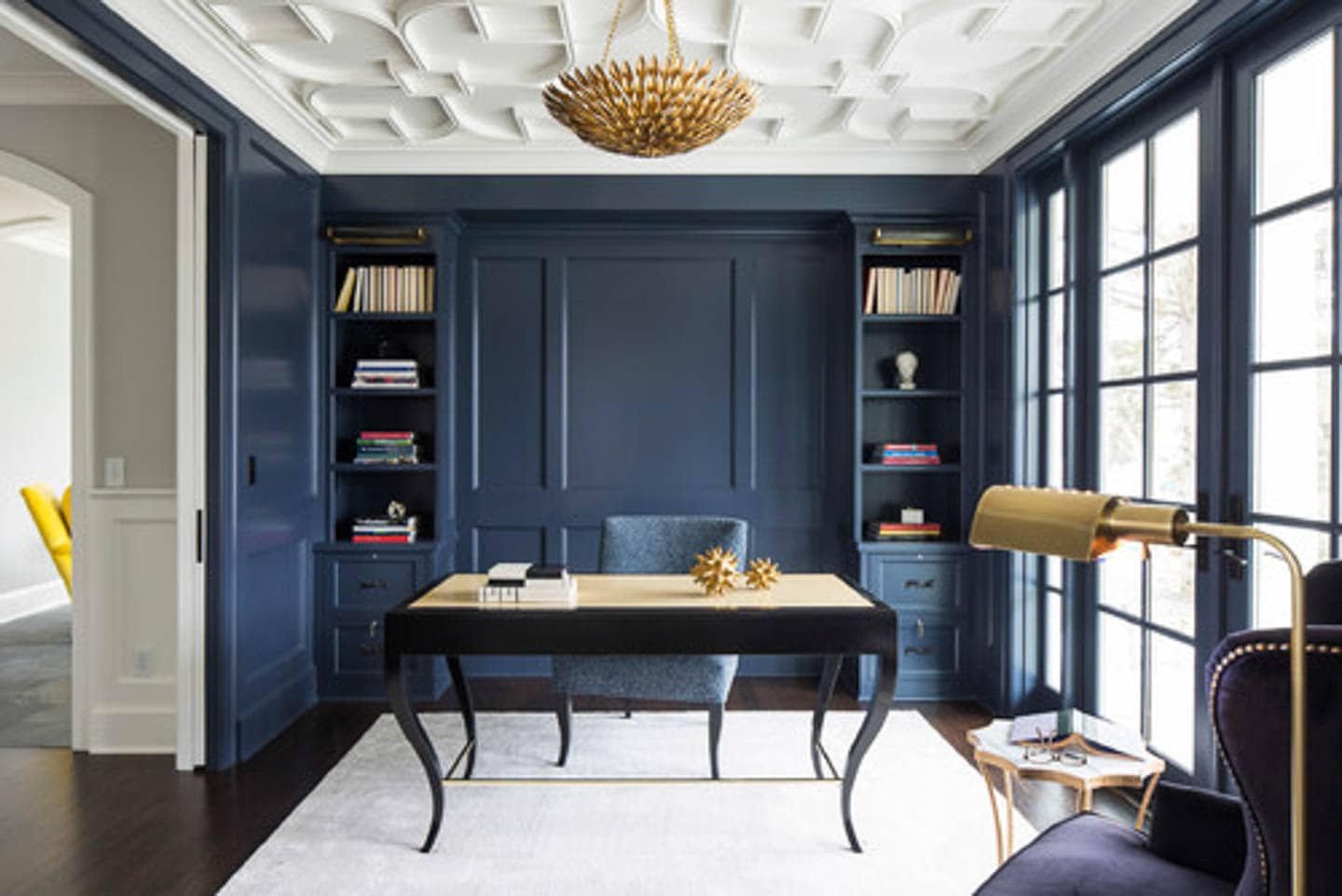 Home office with navy blue walls